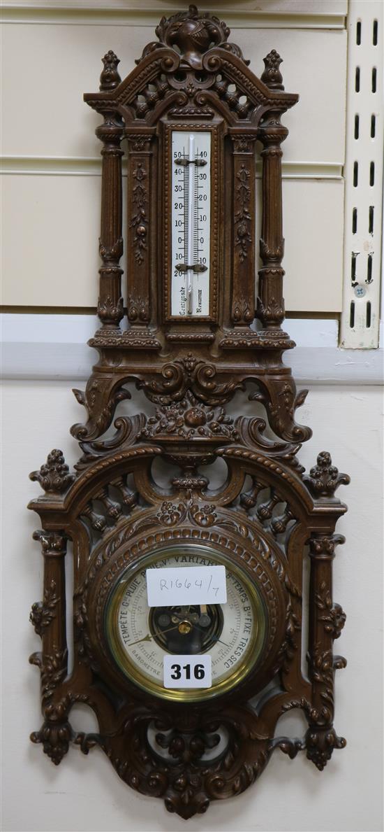 A mahogany aneroid barometer, 55cm.